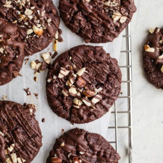 Double Chocolate Chip Hazelnut Cookies made with hazelnut meal, hazelnut butter, cocoa powder, and organic dark chocolate chips for a truly decadent cookies. Gluten-free, grain-free, vegan.