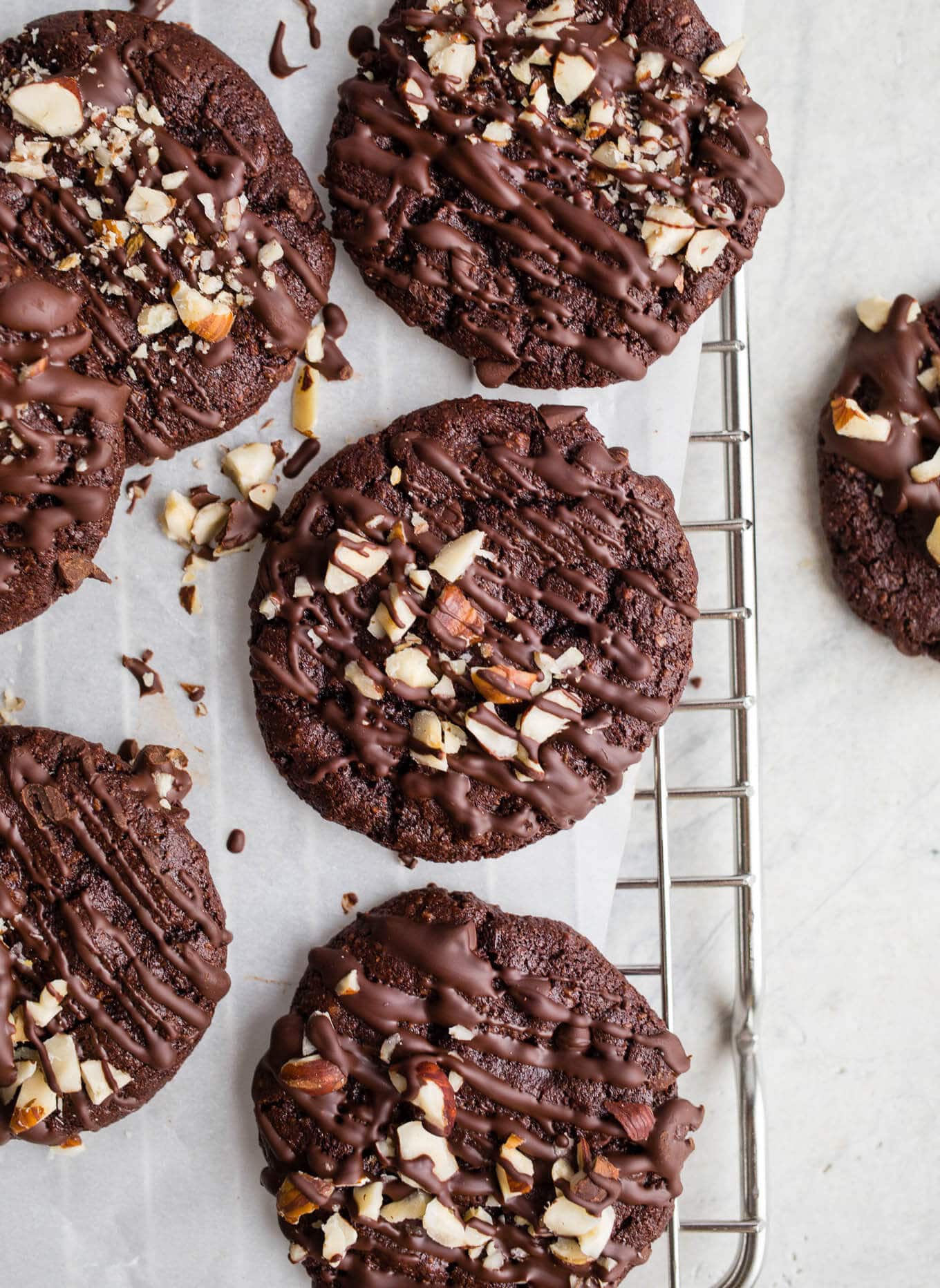 Double Chocolate Chip Hazelnut Cookies made with hazelnut meal, hazelnut butter, cocoa powder, and organic dark chocolate chips for a truly decadent cookie. Gluten-free, grain-free, vegan. 