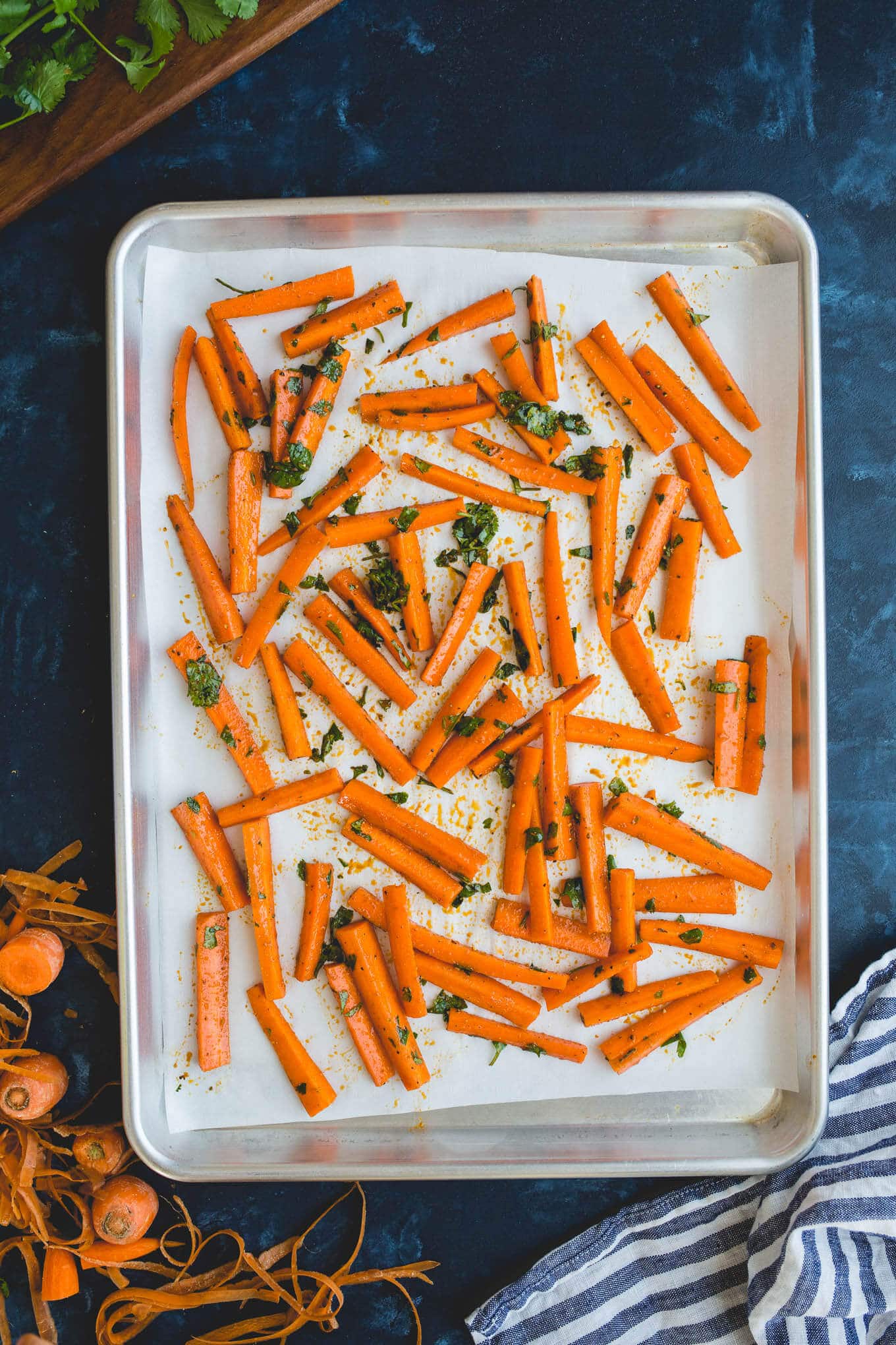 Oven Baked Carrot Fries tossed with olive oil, paprika, garlic powder, salt, pepper, and parsley, for a deliciously healthy snack recipe. Gluten-free, vegan. 
