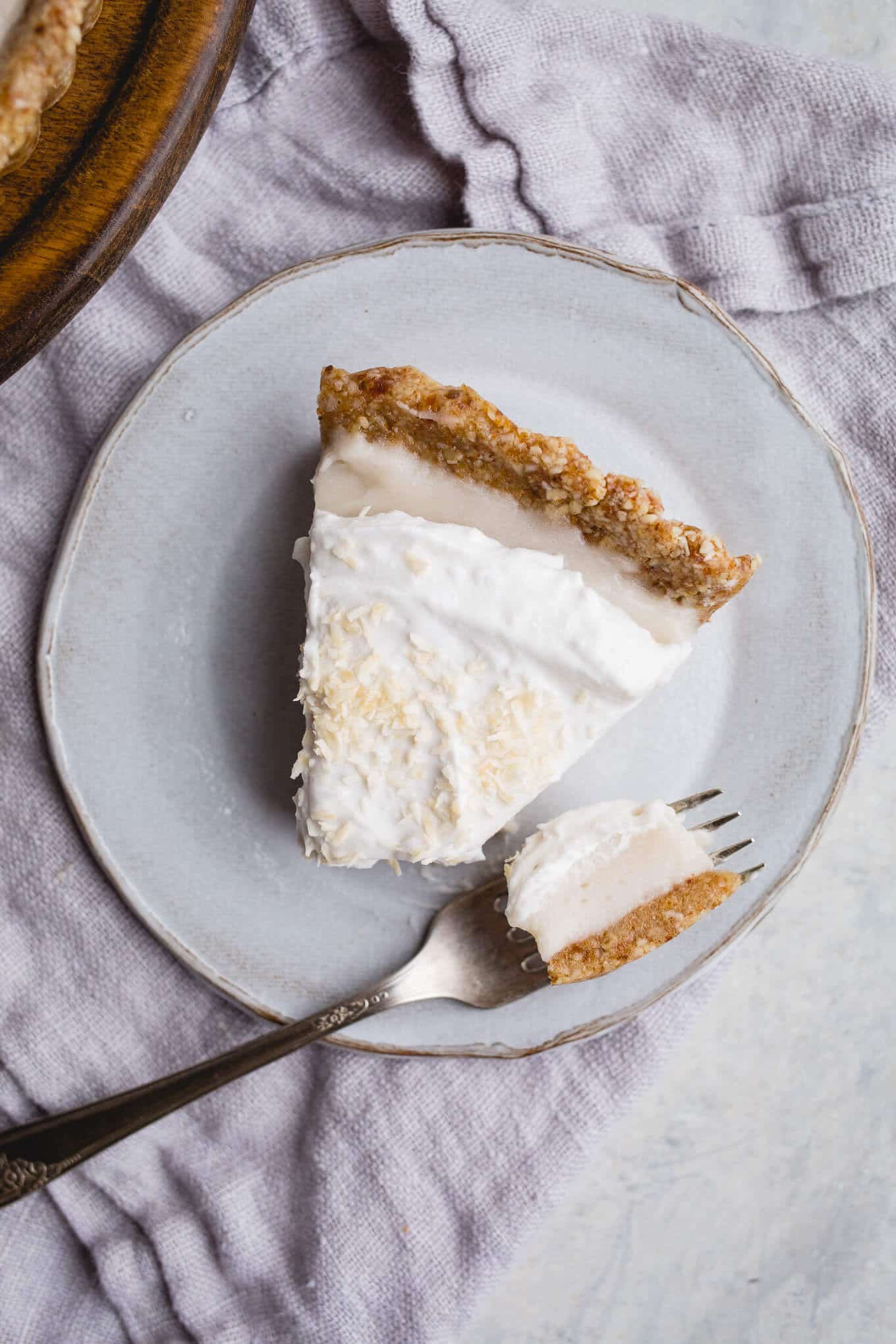 This No-Bake Coconut Cream Pie is made with a sprouted almond press-in crust, coconut milk pudding filling, and topped coconut cream and toasted shredded coconut. Gluten-free, vegan.