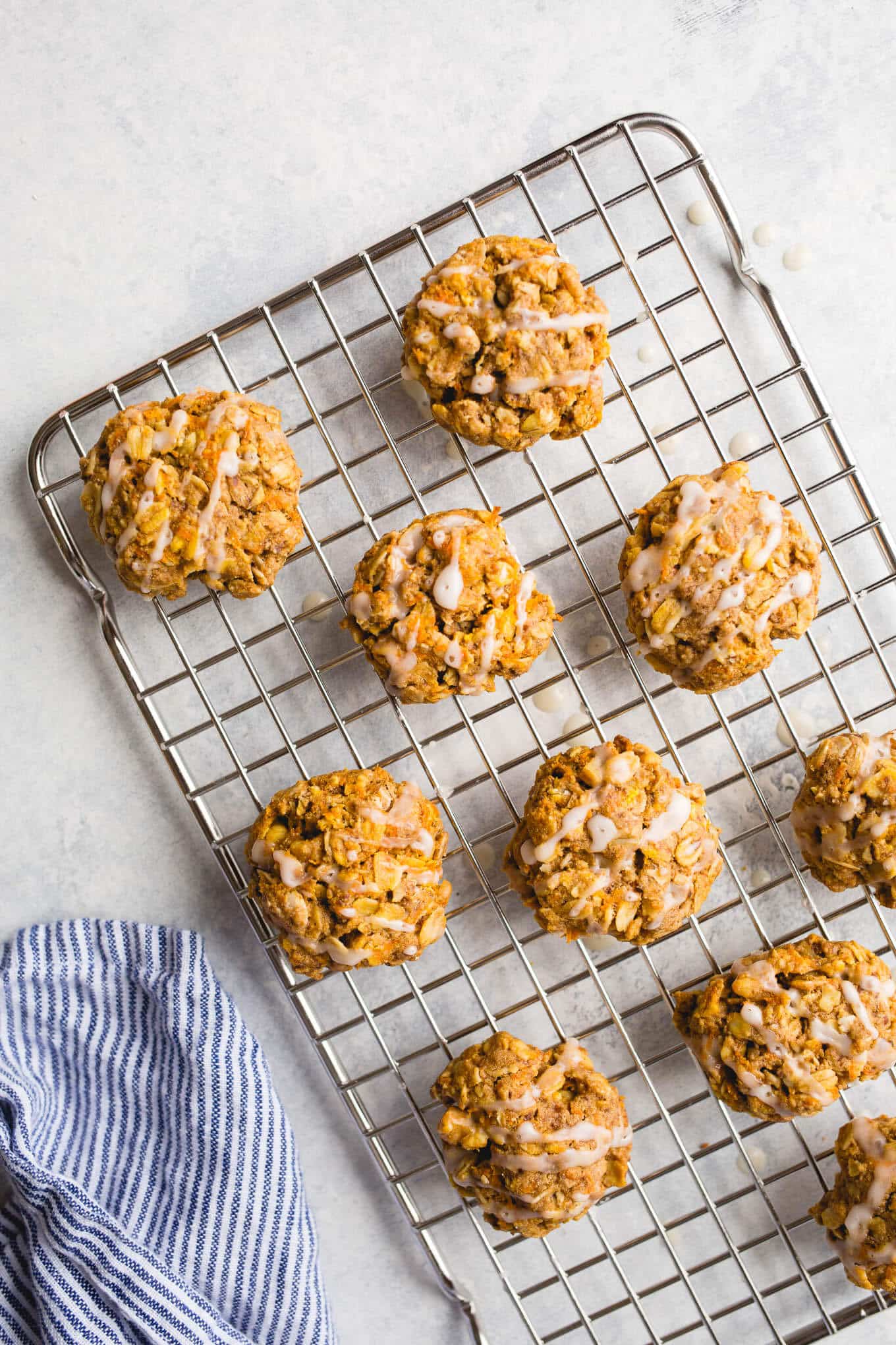 Oatmeal cookies with carrots on a wire rack.