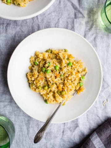 Brown Rice Risotto with Peas and Carrots is a one-pot meal made with simple ingredients. Gluten-free, vegan.