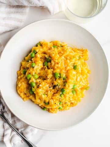 A serving of risotto in a dish.