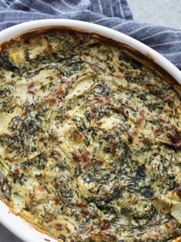Baked Vegan Spinach Artichoke Dip is made dairy-free with a cashew cream base. An easy appetizer dip recipe for a crowd.