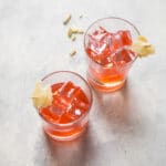 A refreshing cocktail made with berry infused vodka, ginger simple syrup, and lemon juice.
