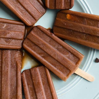 Mocha Iced Coffee Popsicles combine unsweetened cocoa powder, coffee, and almond milk, and honey for cool and creamy healthy frozen treat.