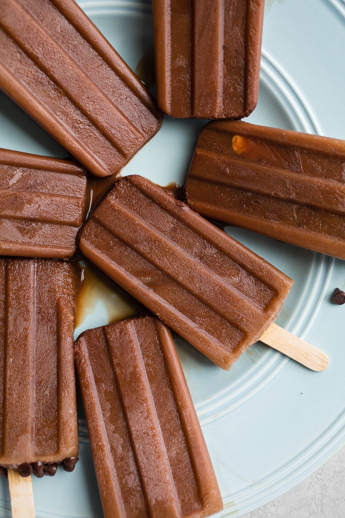 Mocha Iced Coffee Popsicles combine unsweetened cocoa powder, coffee, and almond milk, and honey for cool and creamy easy frozen treat.