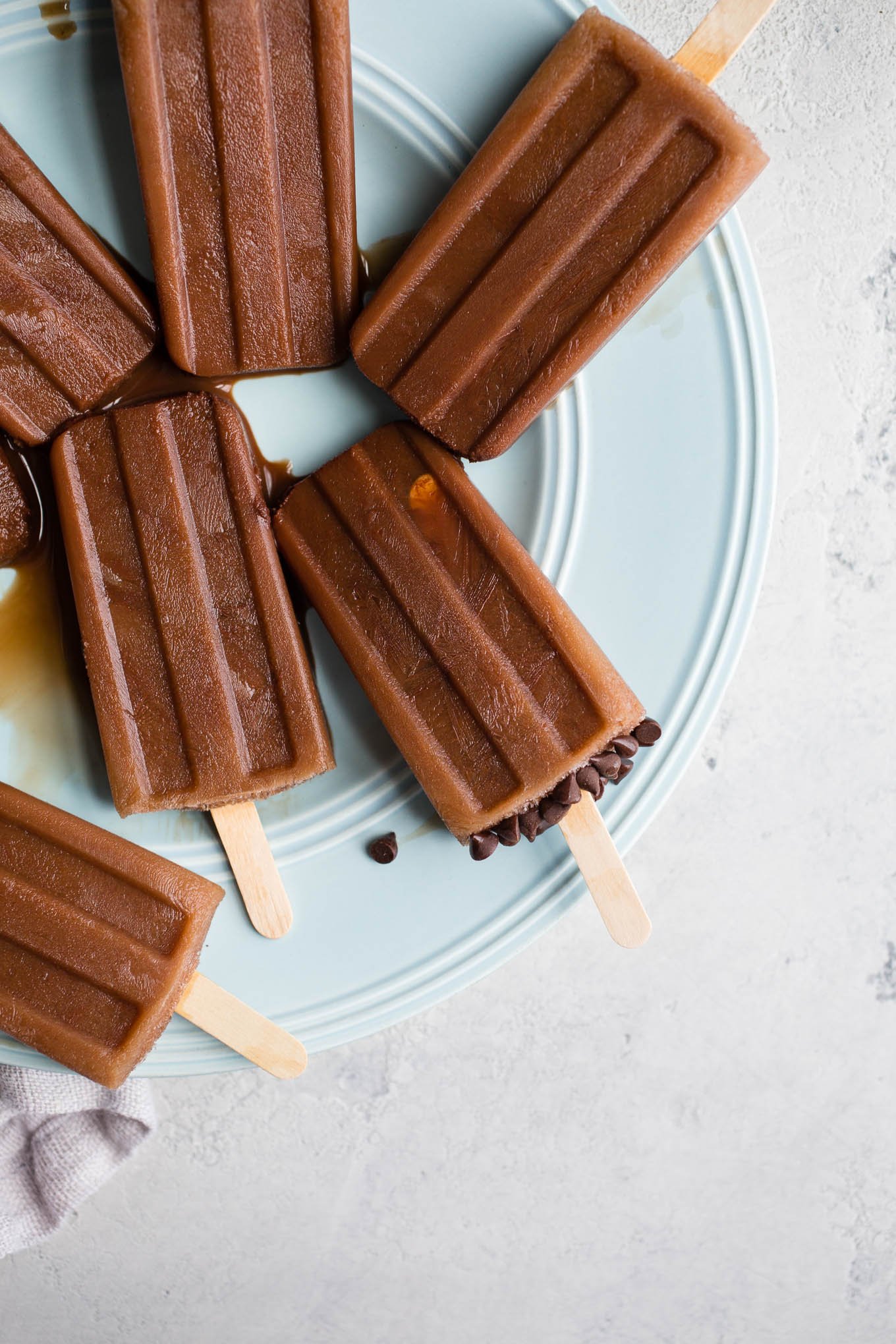 Mocha Iced Coffee Popsicles combine unsweetened cocoa powder, coffee, and almond milk, and honey for cool and creamy homemade frozen treat.