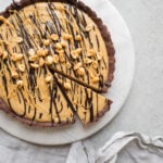 Vegan Peanut Butter Pie made with all-natural peanut butter, coconut milk, and maple syrup in a chocolate almond flour crust. A gluten-free frozen dessert recipe made healthy.