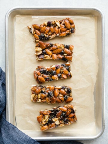 Blueberry Almond Granola Bars made with raw almonds, cashews, and hemp seeds, and bursting with dried blueberries. A healthy granola bars recipe made without refined sugar. Gluten-free, vegan.