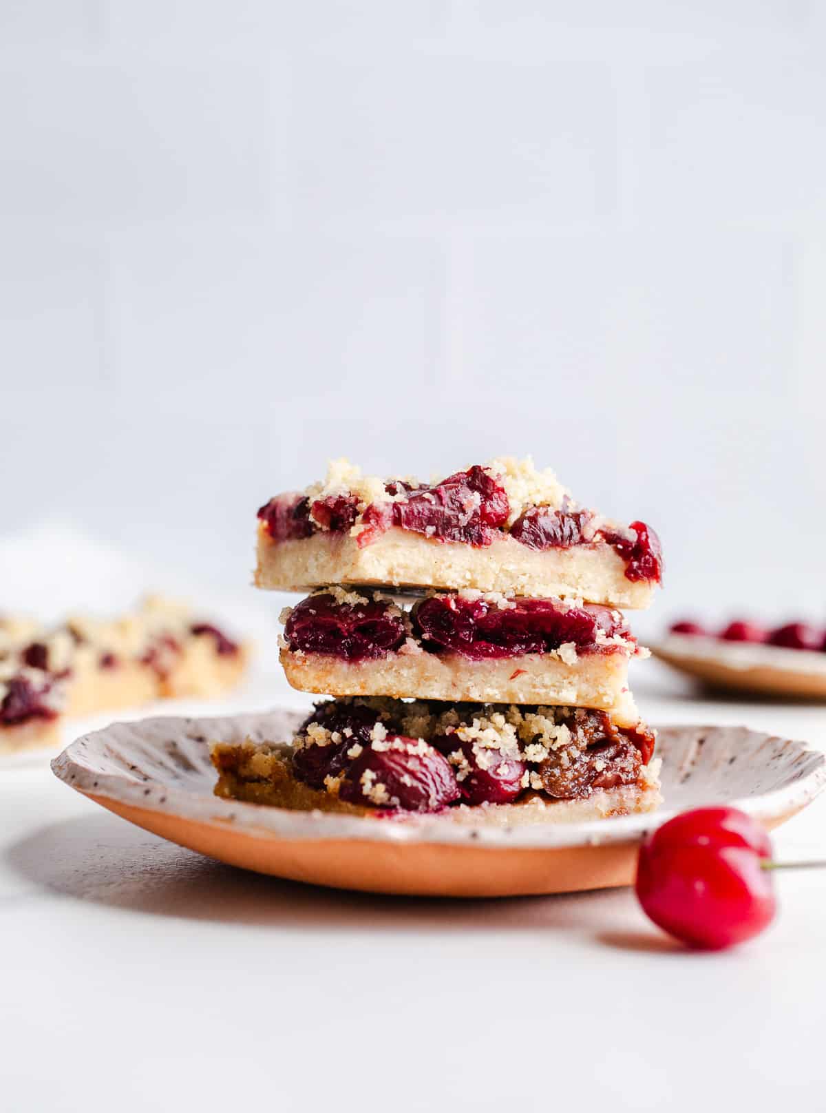 A stack of cherry crumb bars. 