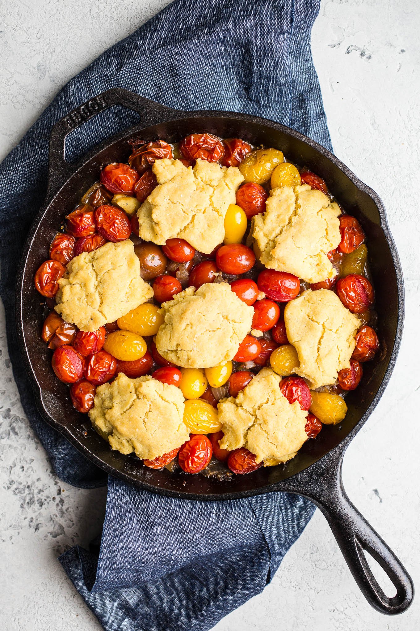 tomatoes and biscuits in skillet