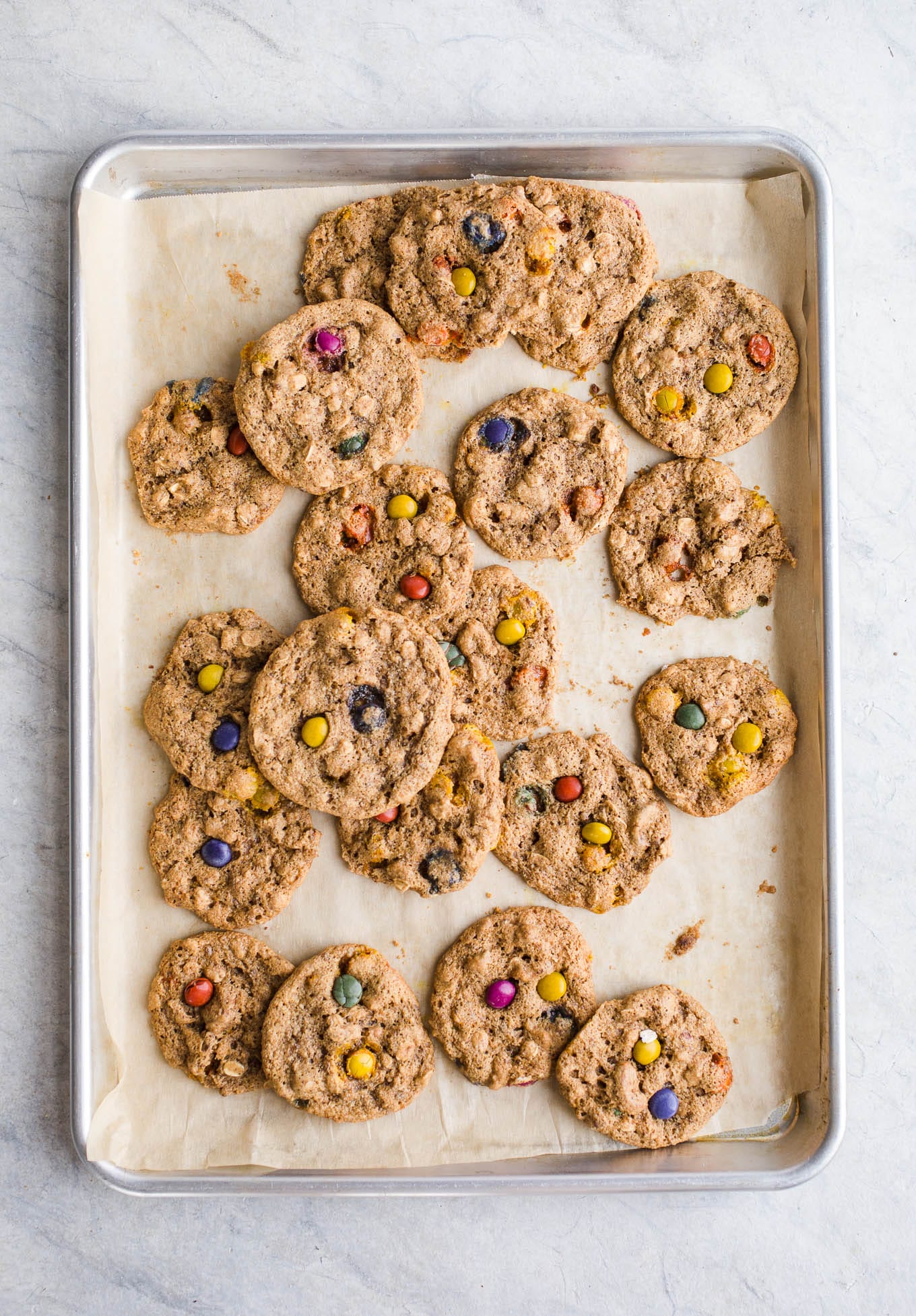 Almond Butter Monster Cookies made with gluten-free oats, pretzels, and chocolate pieces for a protein-packed gluten-free cookie. Vegan.