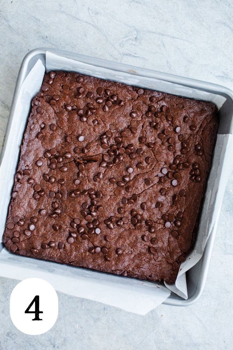 Baked brownies with chocolate chips on top. 