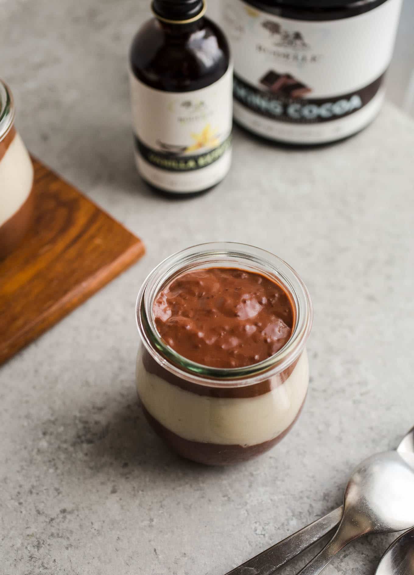 Vegan Chocolate Vanilla Pudding Cups made with rich chocolate cocoa powder, coconut milk, almond milk, maple syrup, and pure vanilla extract. An easy gluten-free, dairy-free pudding recipe!