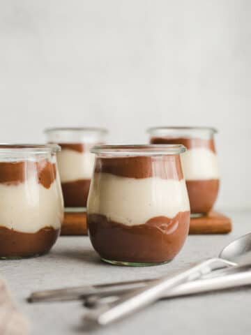 Vegan Chocolate Vanilla Pudding Cups made with rich chocolate cocoa powder, coconut milk, almond milk, maple syrup, and pure vanilla extract. An easy gluten-free, dairy-free pudding recipe!