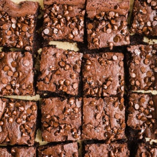 Vegan Tahini Brownies made with rich cocoa powder, tahini, maple syrup, chocolate chips, and sea salt. Gluten-free.