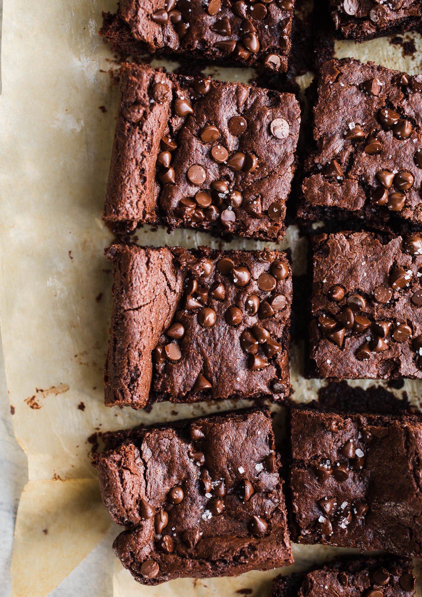 Vegan Tahini Brownies made with rich cocoa powder, tahini, maple syrup, chocolate chips, and sea salt. Gluten-free. 