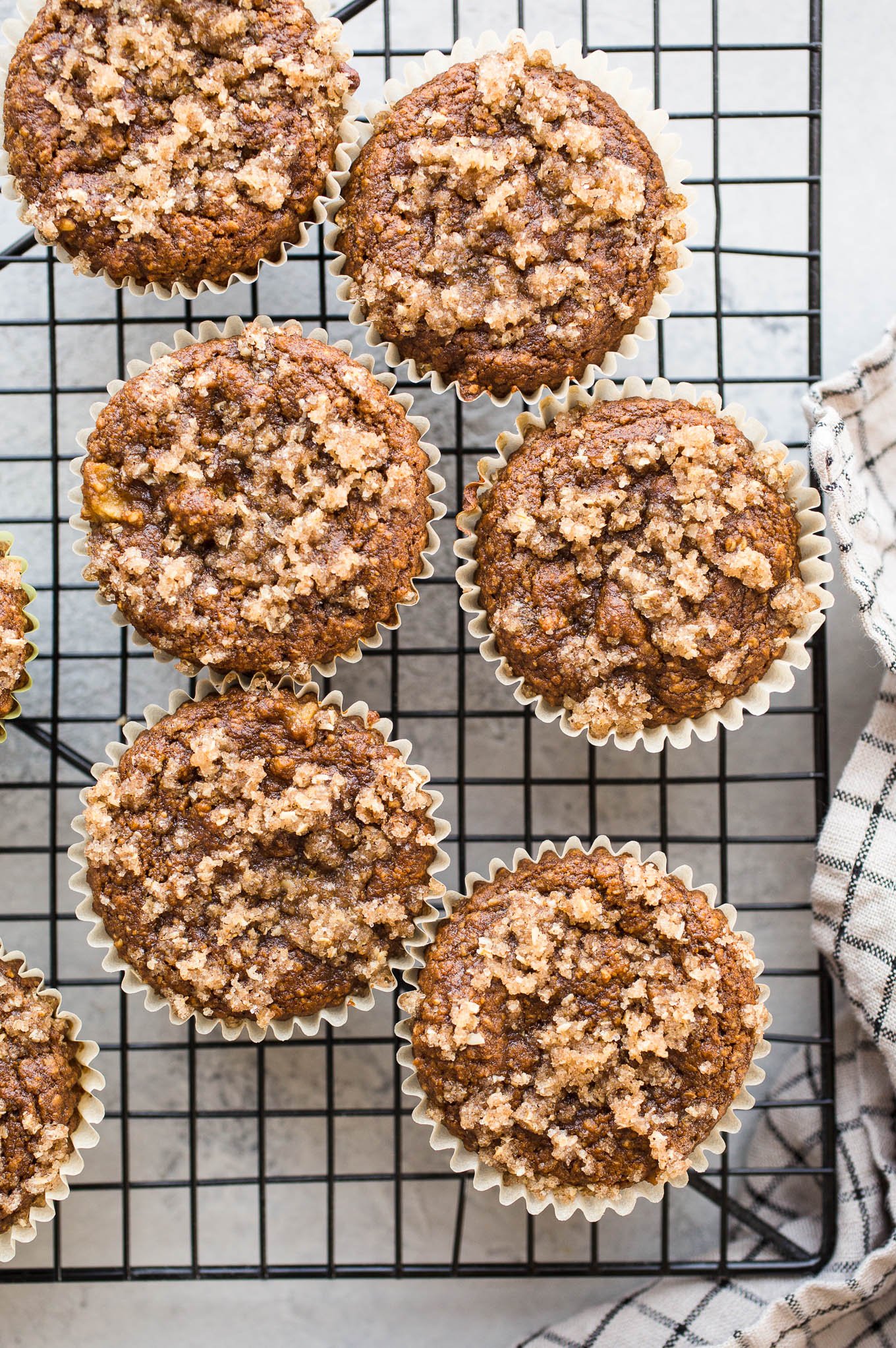 Gluten-Free Apple Crumb Muffins are made with whole grain gluten-free oat flour, almond flour, applesauce, and coconut sugar topped with a cinnamon sugar crumble. Dairy-free, vegan.
