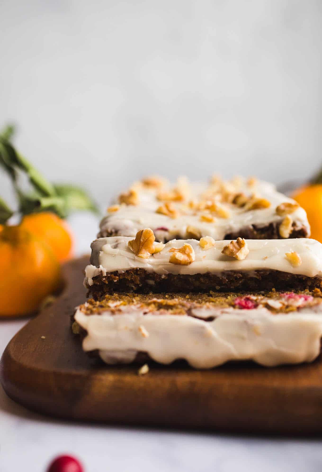 A healthier, moist, Gluten-Free Cranberry Orange Bread with an orange glaze made with almond and oat flours. Vegan. Have it for breakfast or dessert!