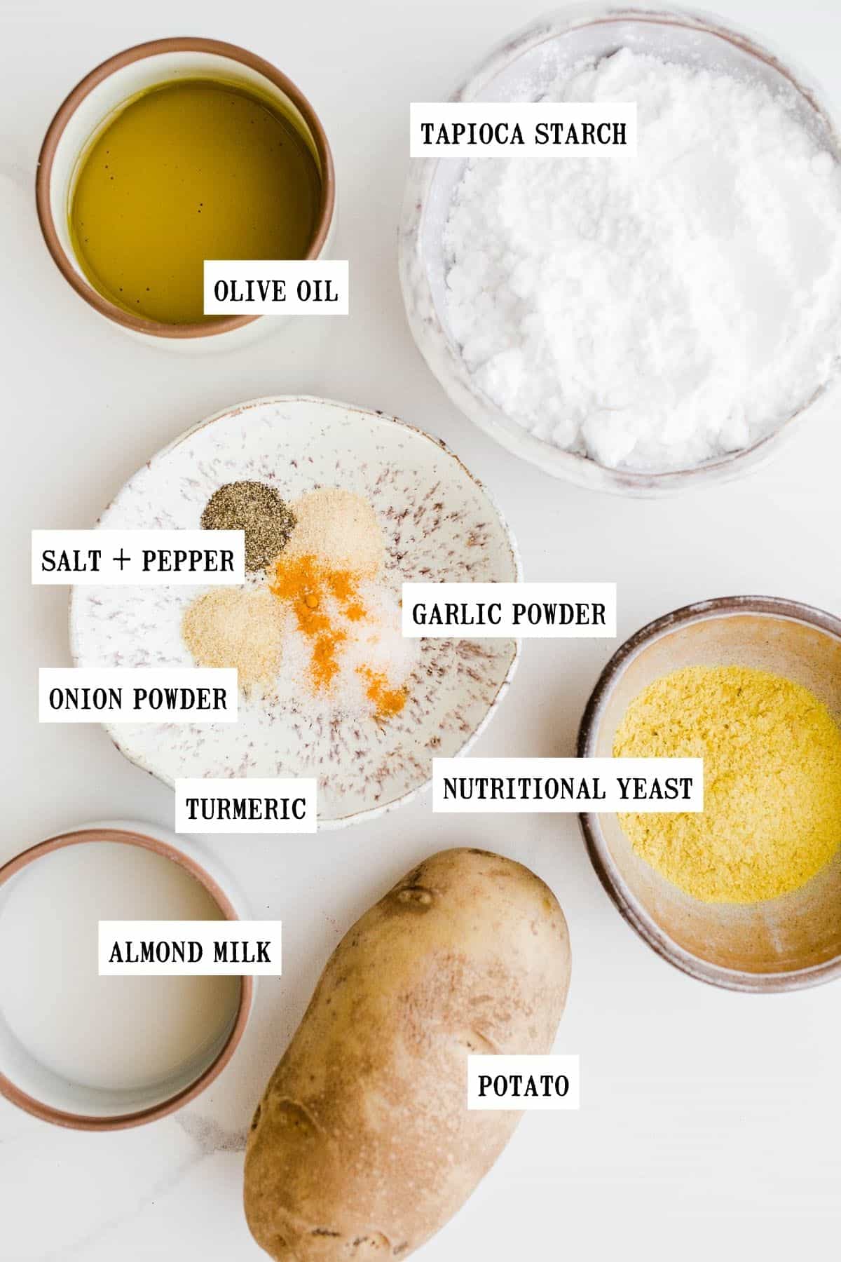 Ingredients to make vegan cheese balls in small bowls.