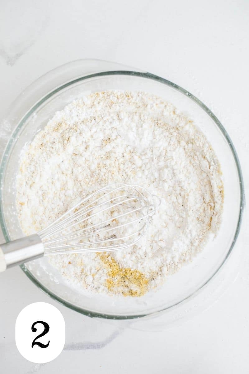 Tapioca starch mixed with seasonings in a glass mixing bowl.