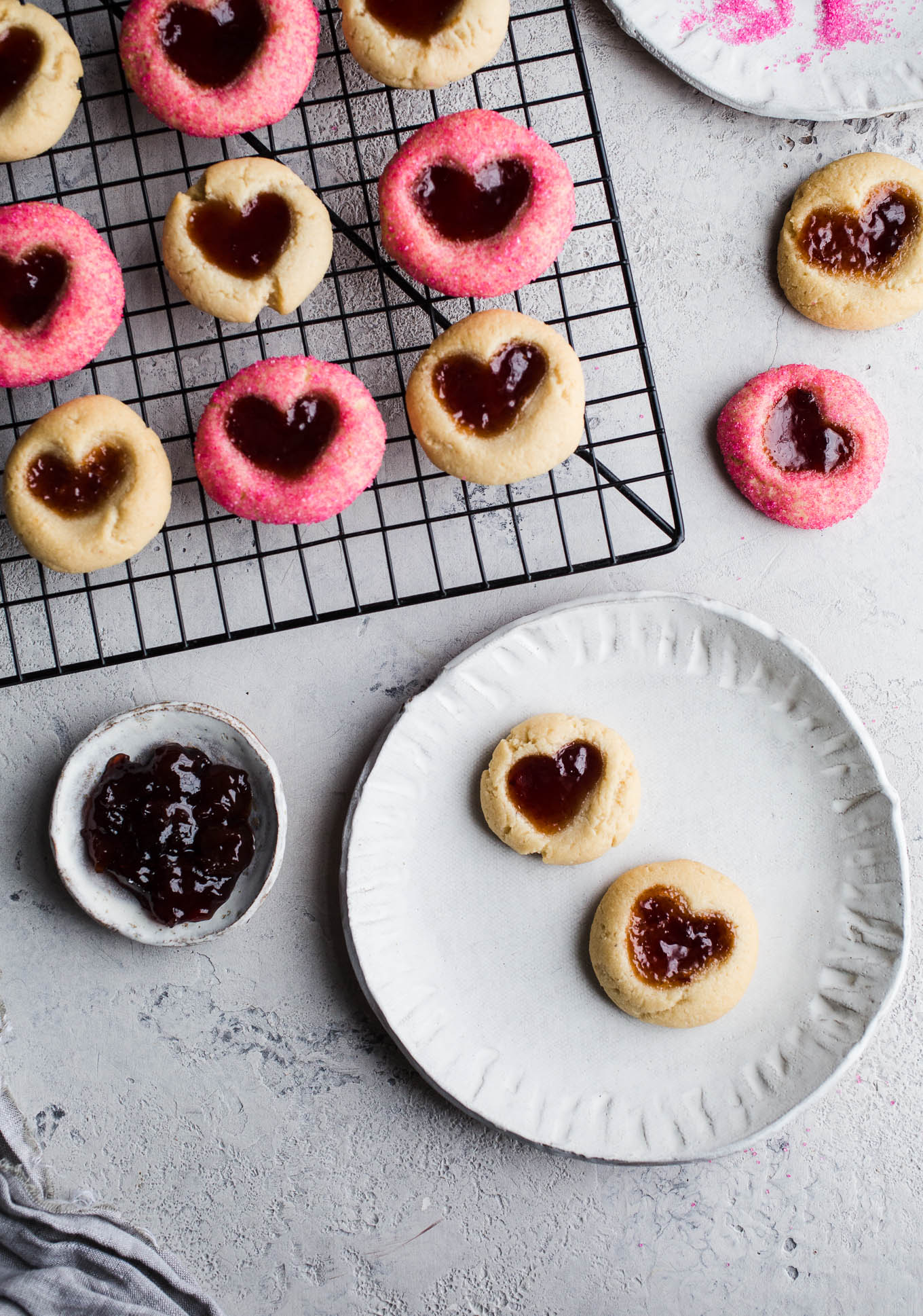 Easy 5-ingredient thumbprint cookies made with almond flour and sweetened with maple syrup, filled with your favorite jam. A gluten-free, vegan thumbprint cookie recipe!
