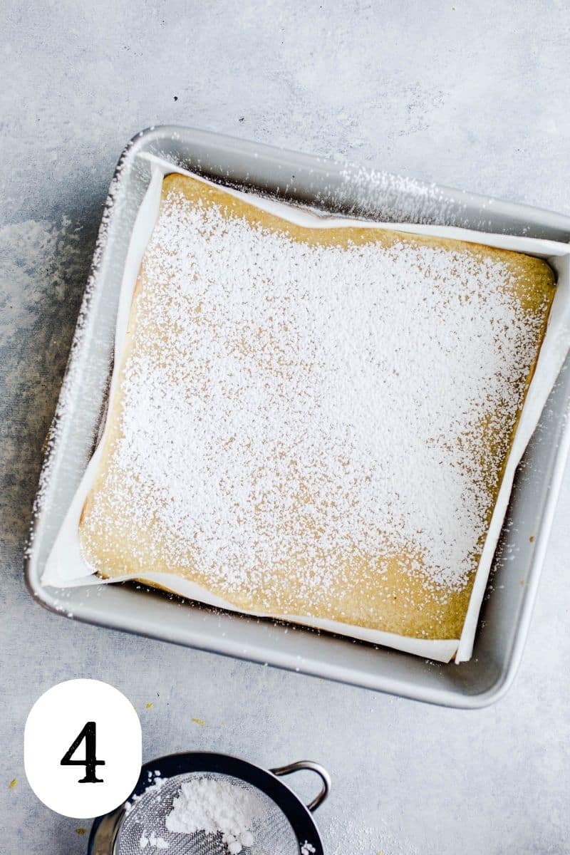 Baked bars in square pan sprinkled with powdered sugar.