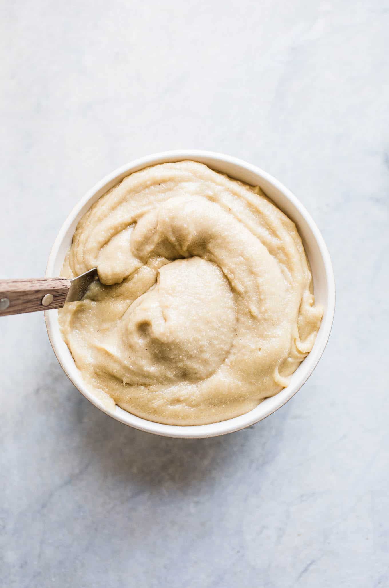 A bowl full of cashew cream frosting.