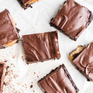 Caramel brownies on parchment paper.
