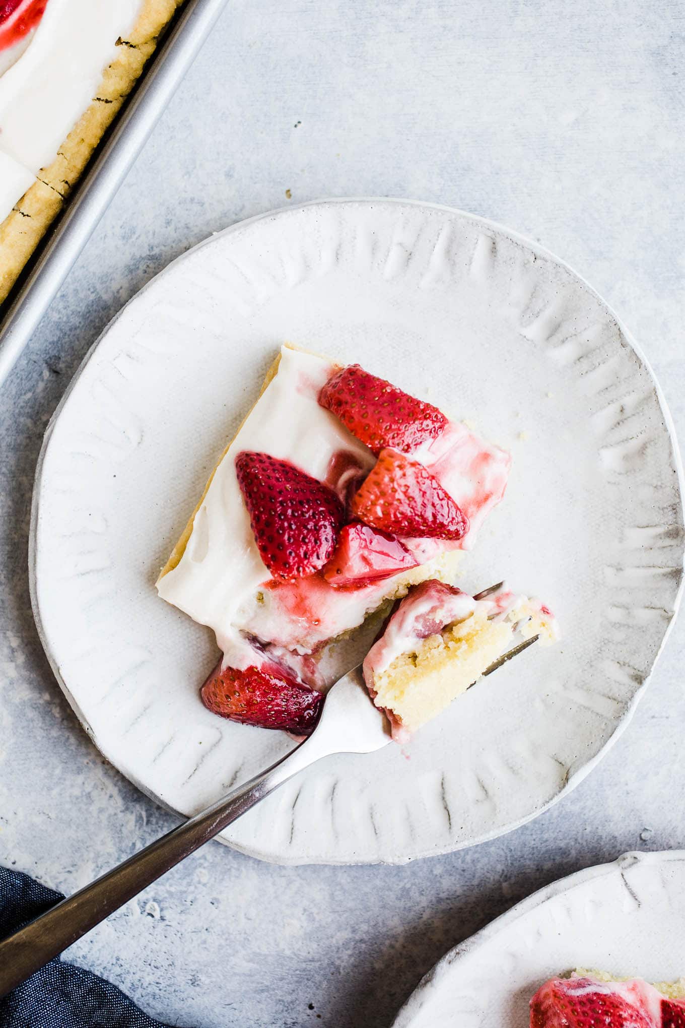 A piece of strawberry shortcake on a plate. 