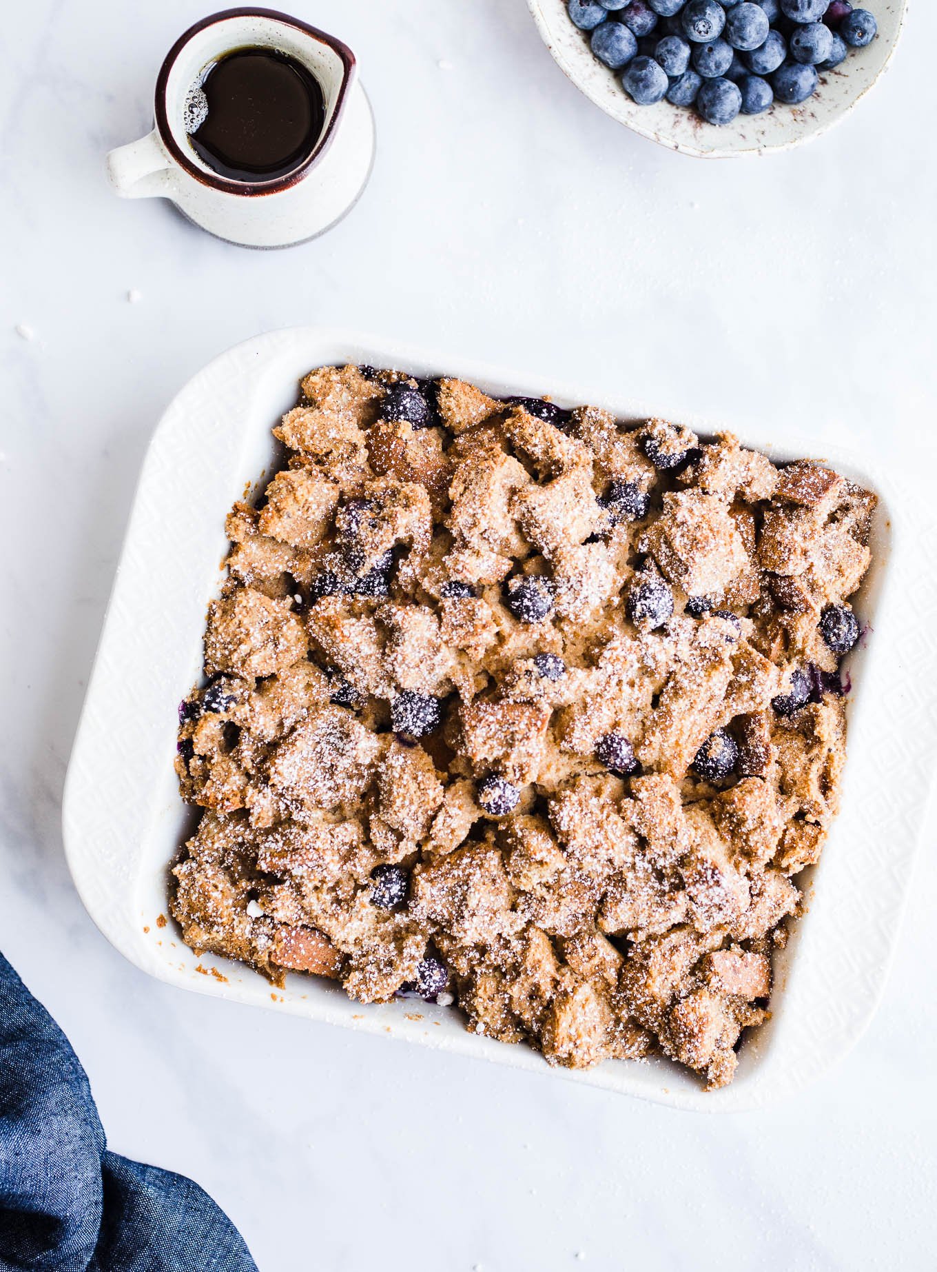 French toast casserole in a white baking dish.