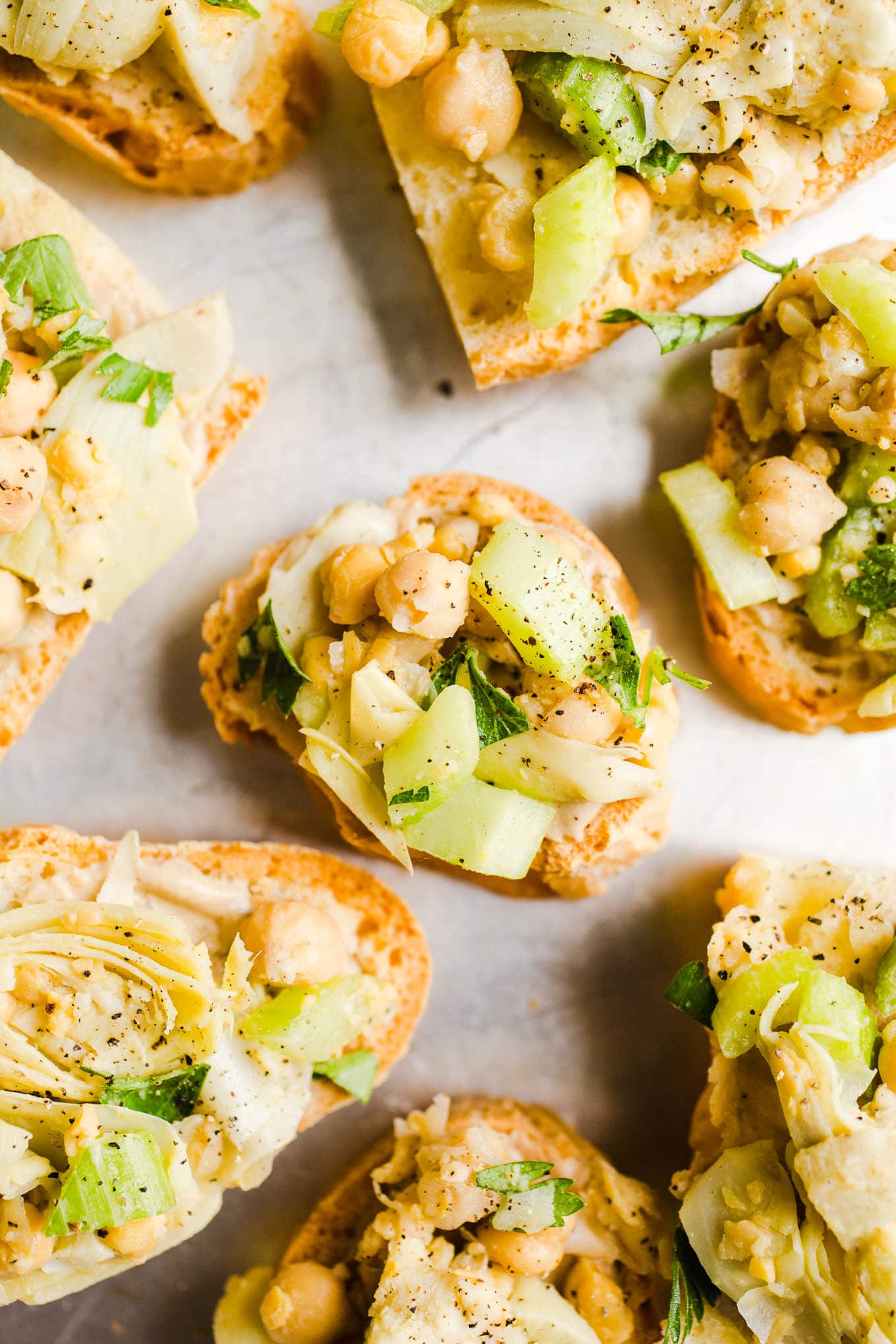 Garbanzo bean salad on sliced bread.