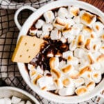 Chocolate dip with toasted marshmallows on top.