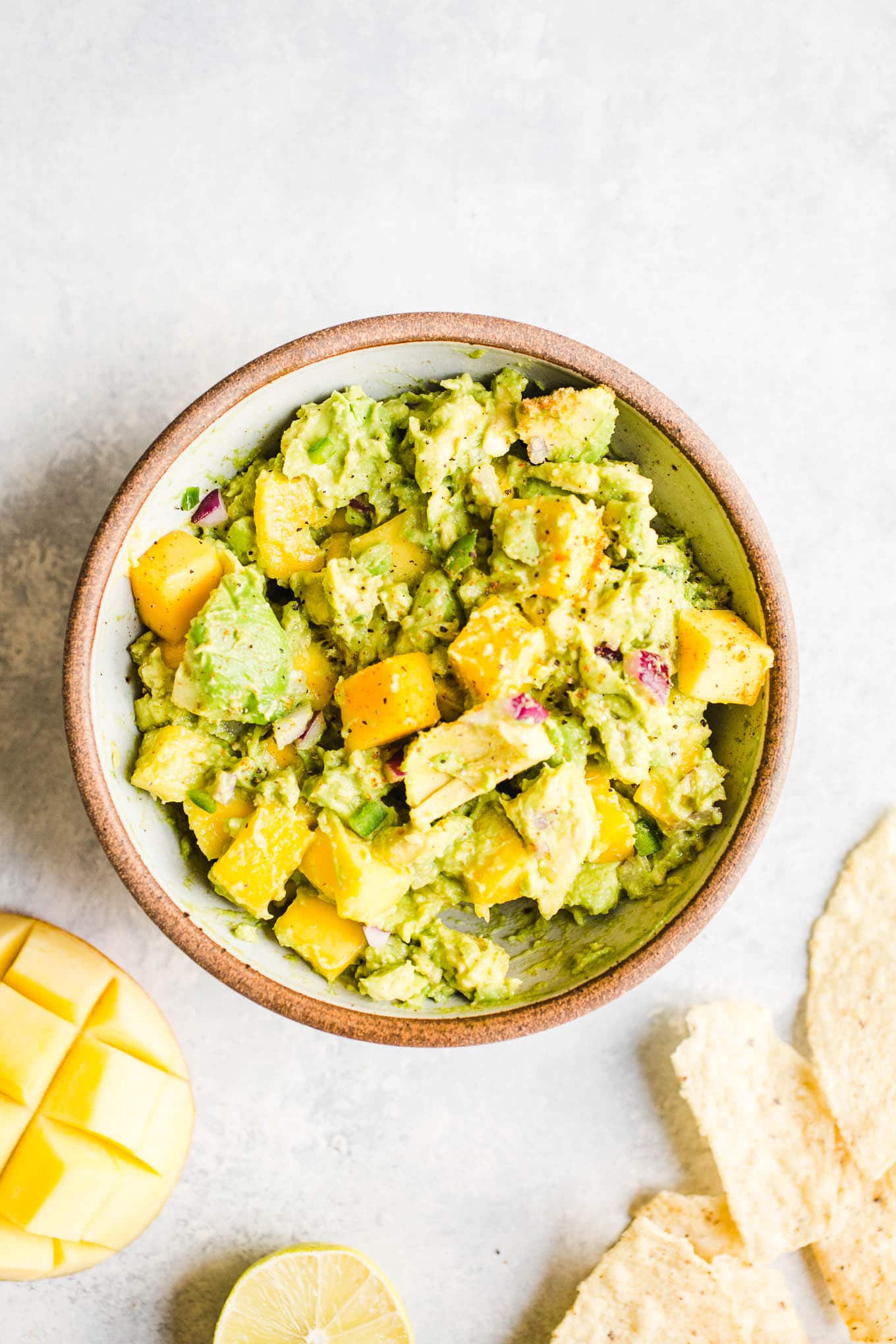 Guacamole with mango in a bowl.