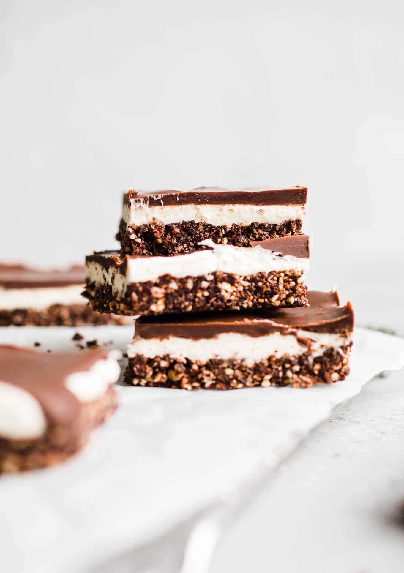 Three layered bars stacked on a wire rack.