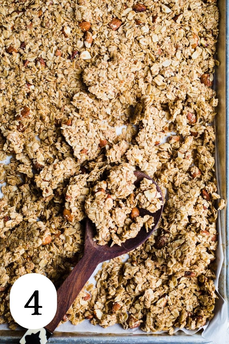 Clumpy granola in a baking pan.
