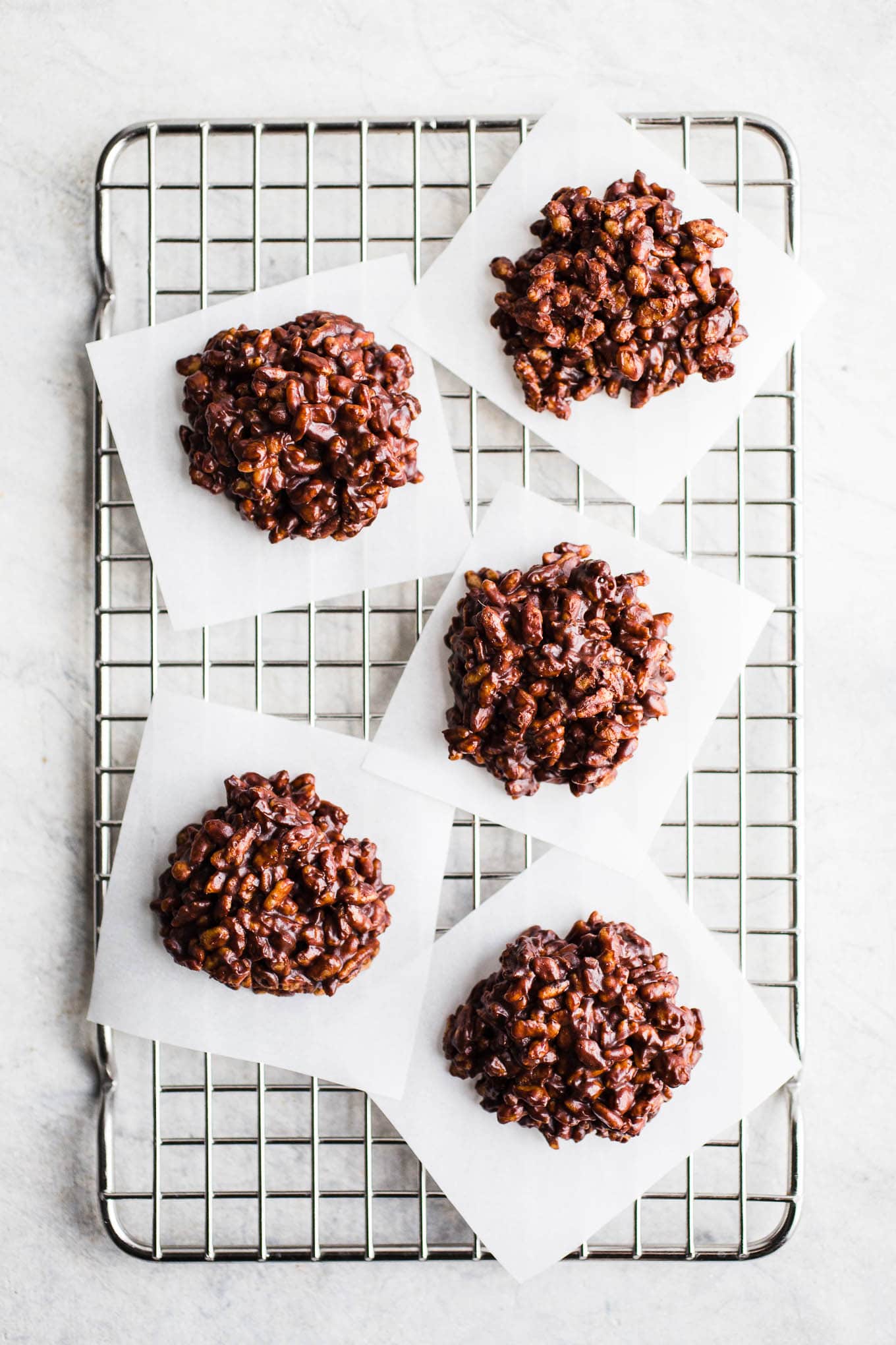 Crispy chocolate cookies on a cooling rack. 