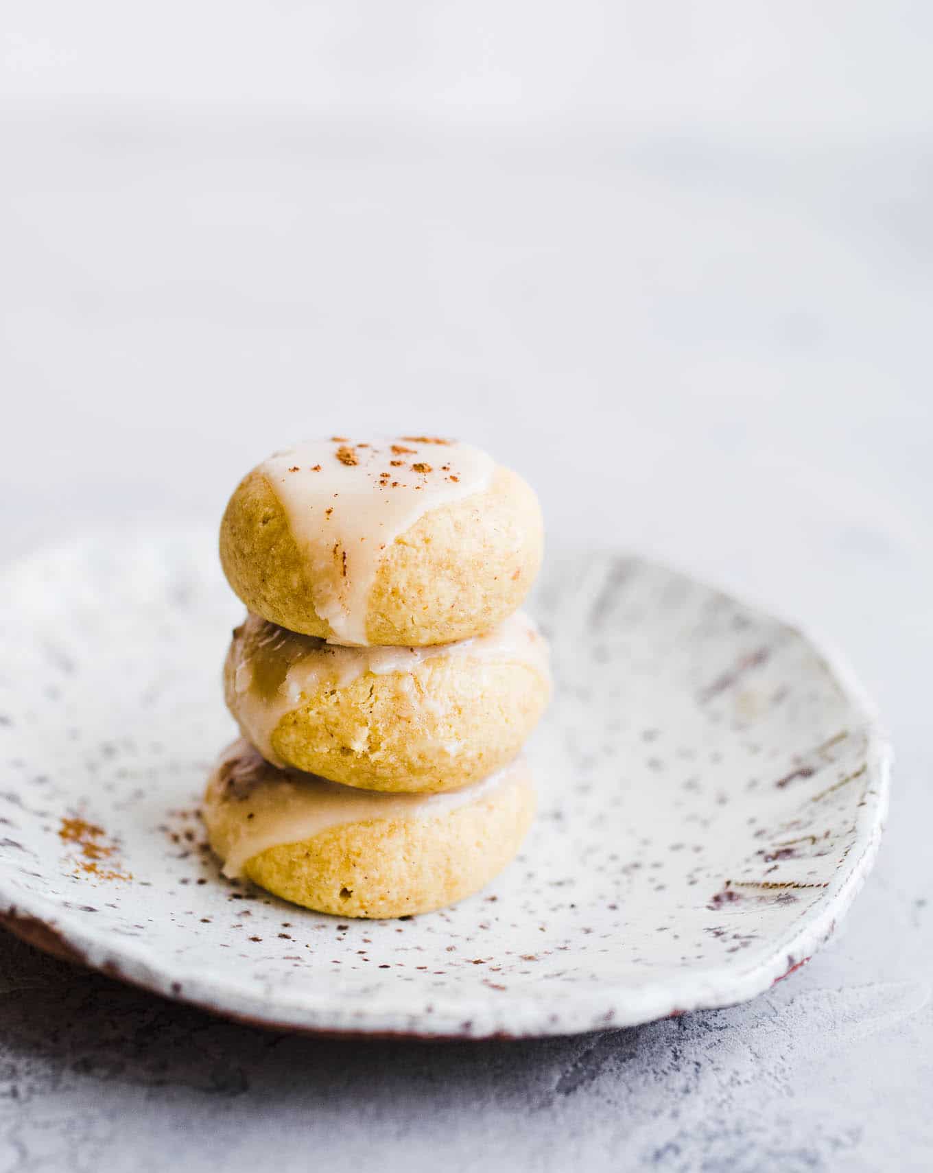 Small cookies stacked on a plate. 