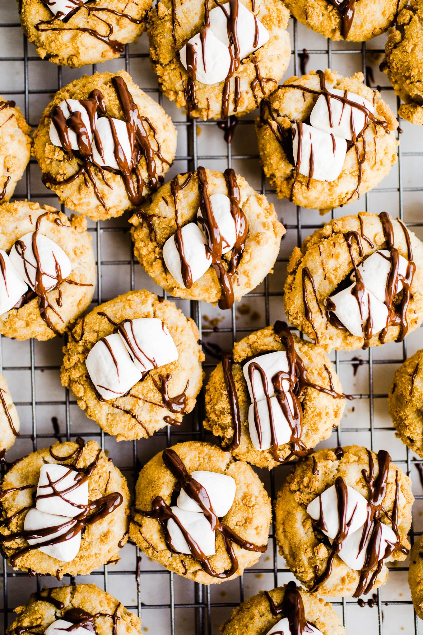 Thumbprint cookies on a wire cooling rack.