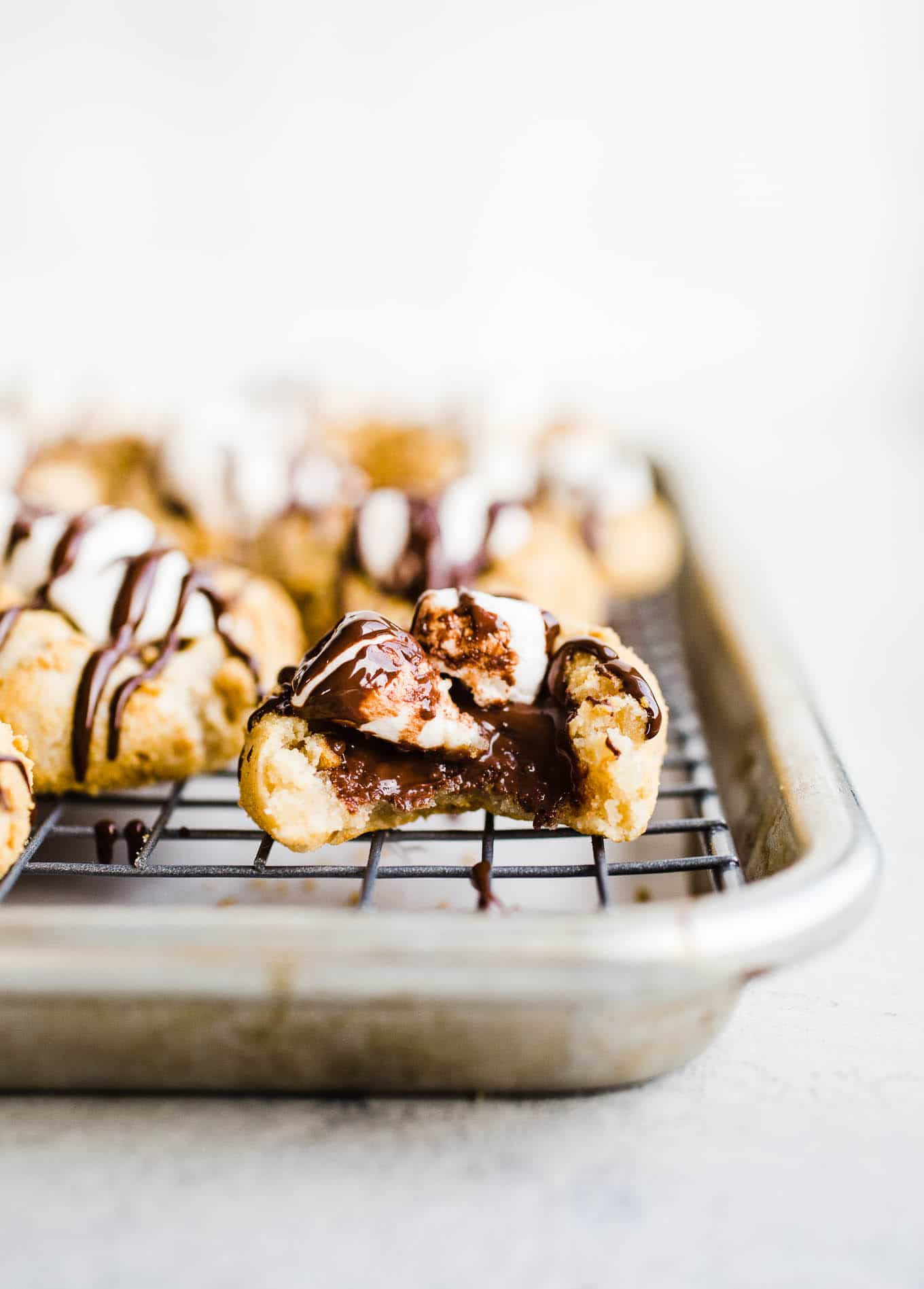 Thumbprint cookies with chocolate and marshmallows.