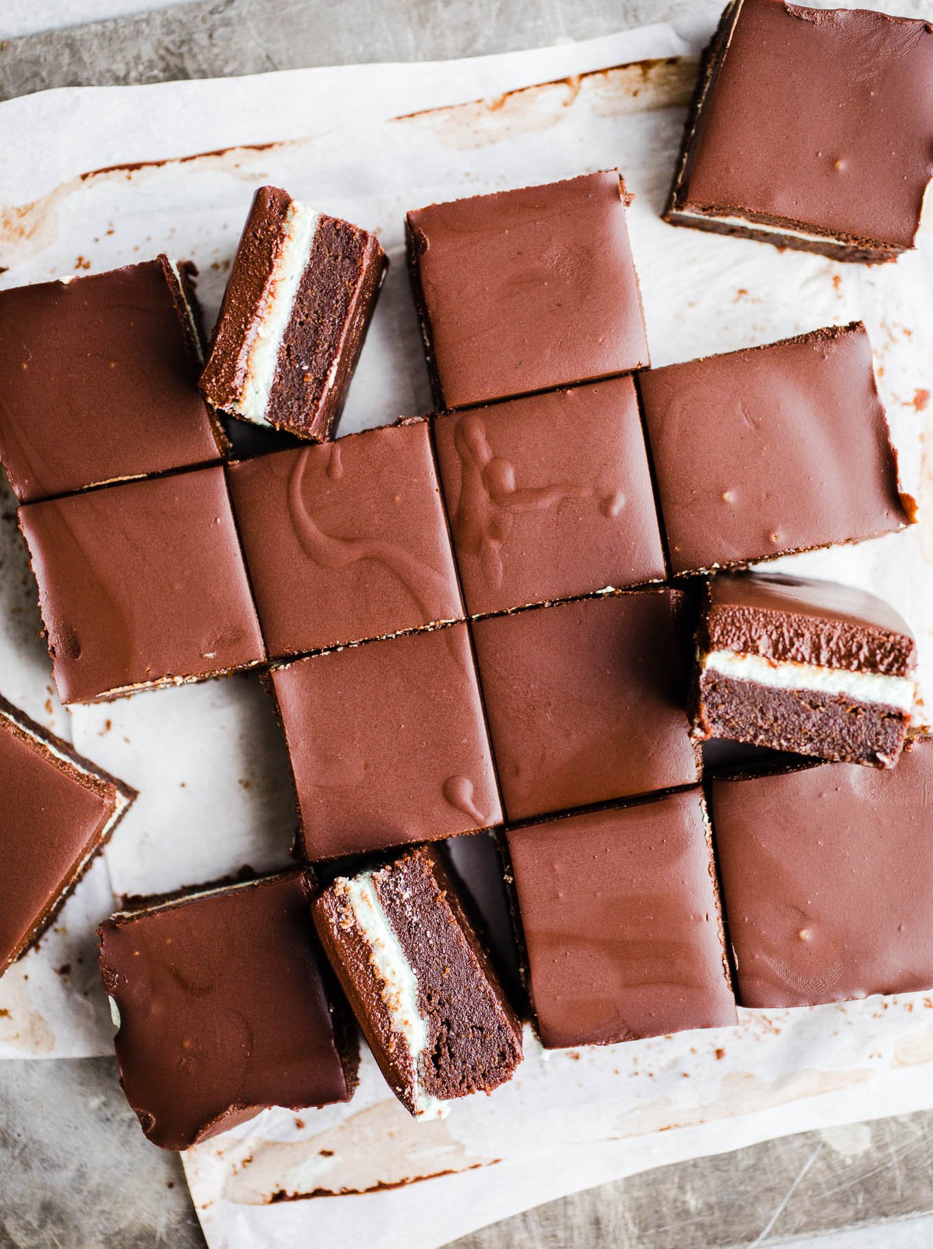 Layered brownies on a baking sheet. 