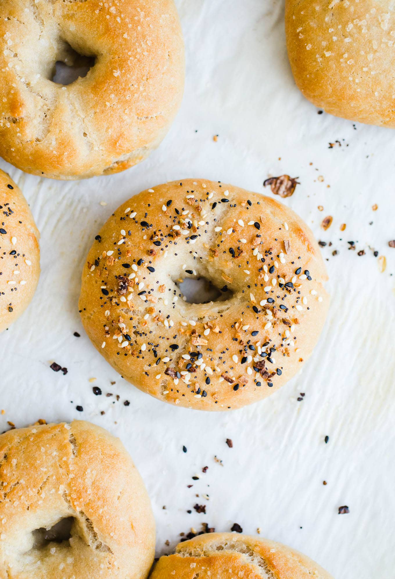 Baked bagels on a baking sheet.