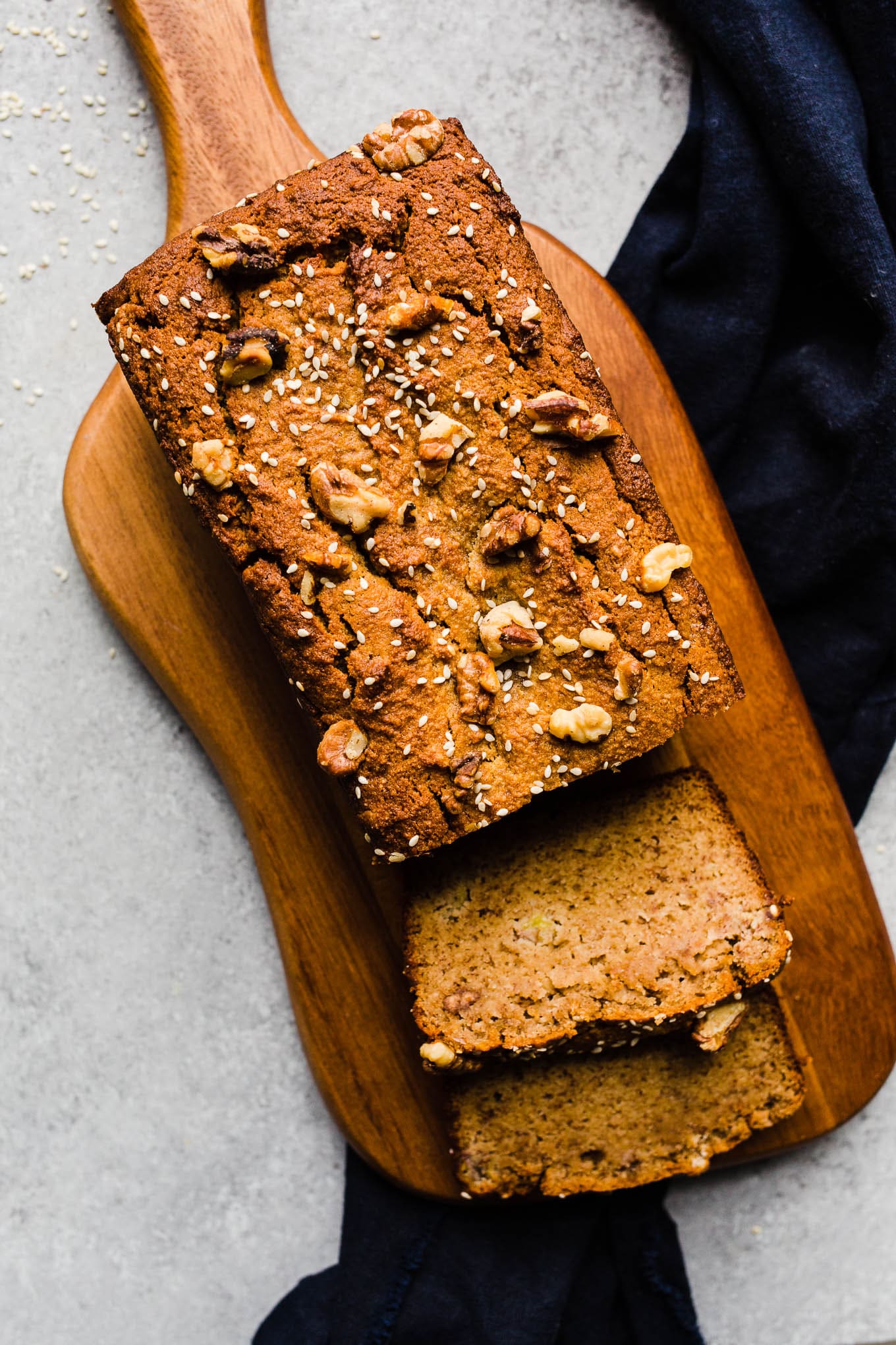 A loaf of bread topped with sesame seeds.