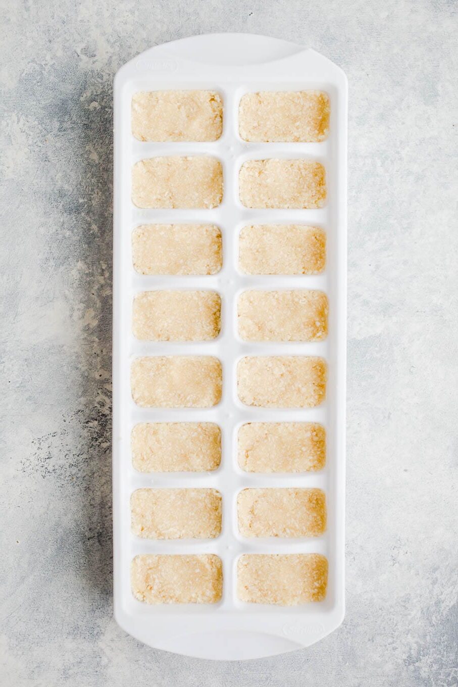 Coconut in a ice cube tray.