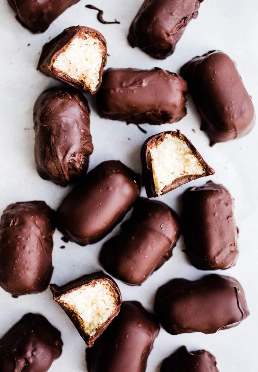 Chocolate covered candies on a baking sheet.