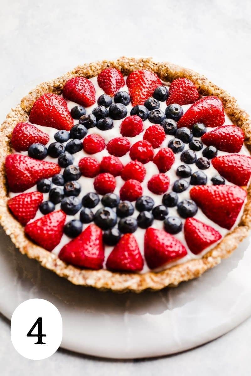 A mixed berry tart with a glaze coating.