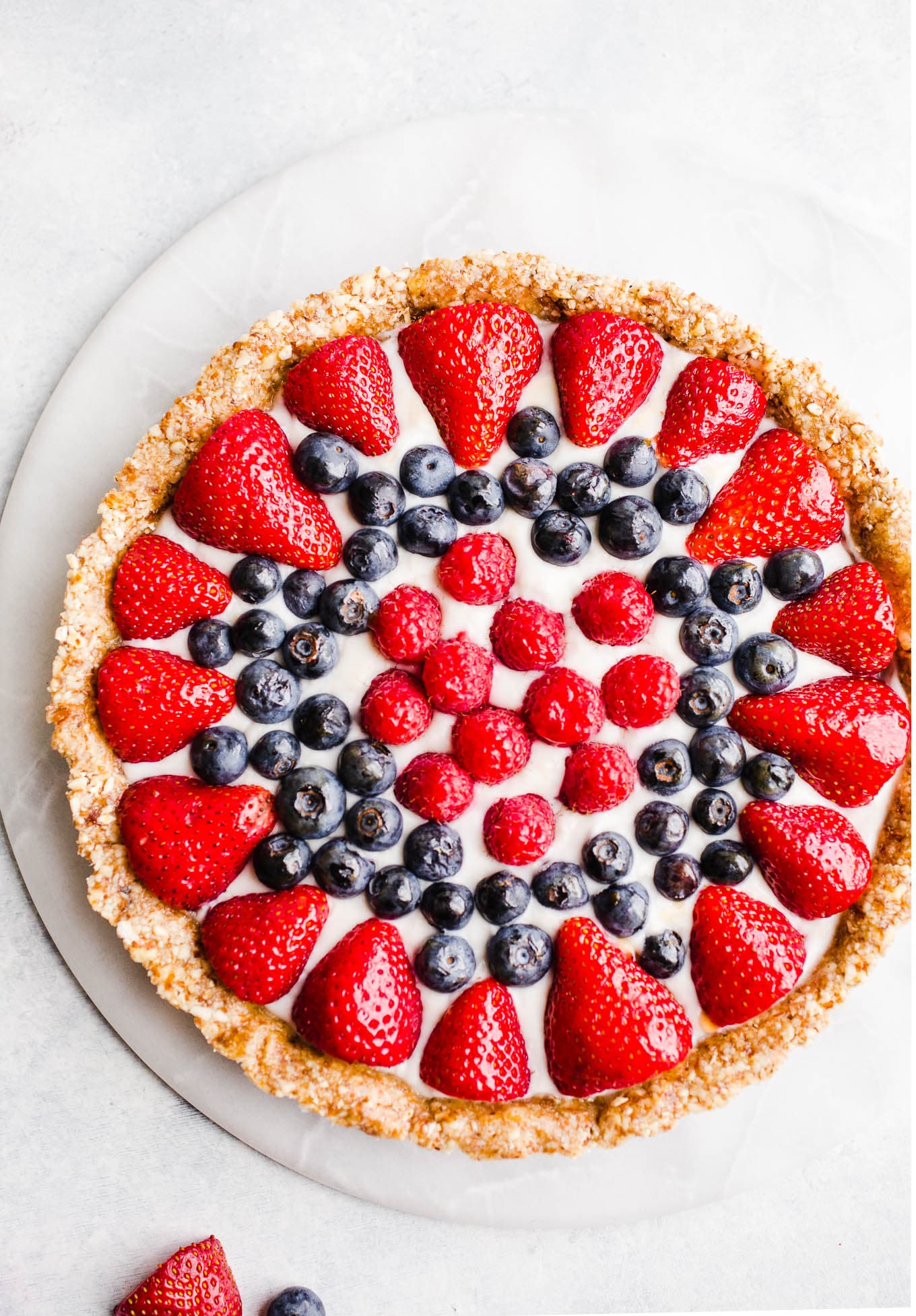 No-Bake Berry Tart on a marble lazy susan.