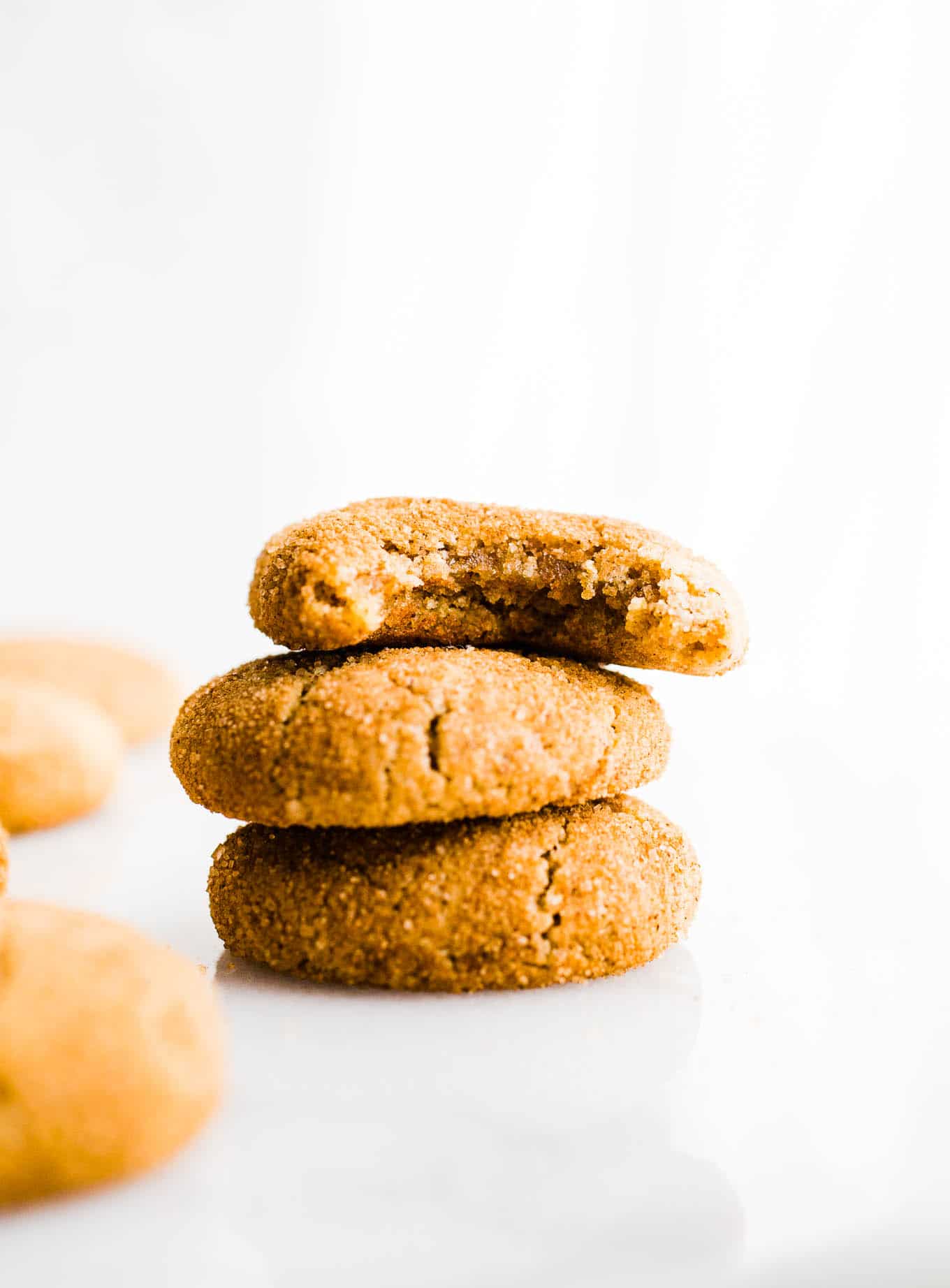 Cookies stacked on a white platter. 