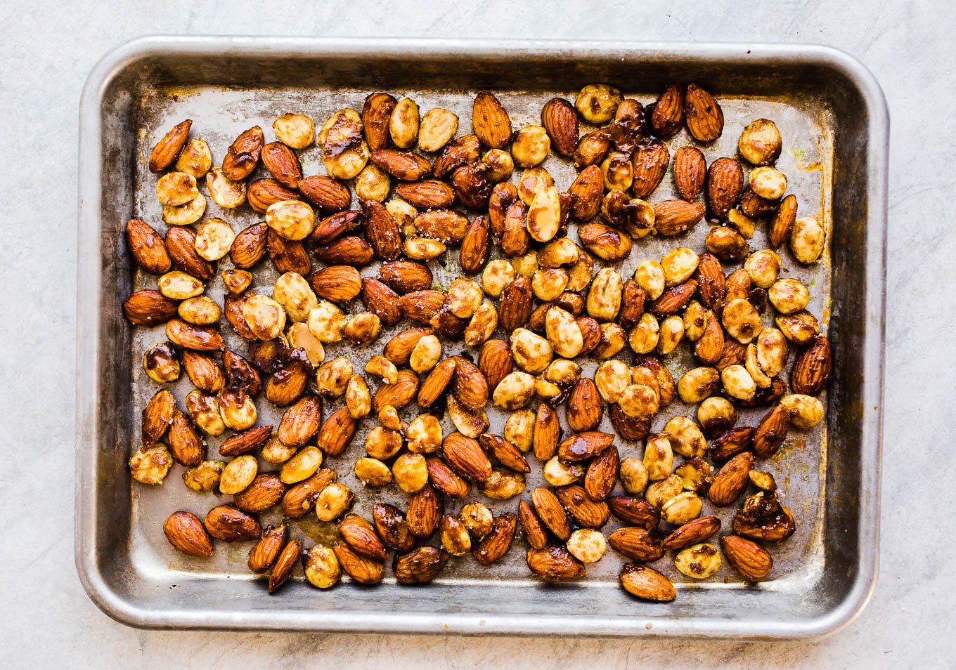 spiced almonds on baking sheet